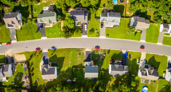 An aerial shot of a neighbhourhood with groomed lawns